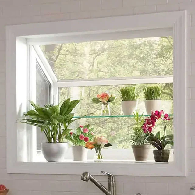 Garden window over a kitchen sink with potted plants on a glass shelf