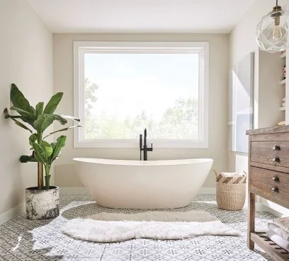 Bathroom with a freestanding tub under a wide window